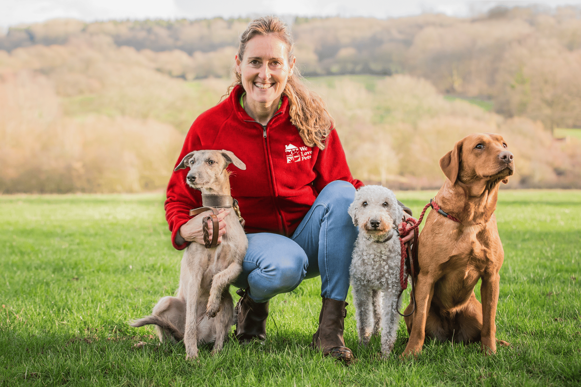 Happy We Love Pets franchisee out walking three dogs Happy We Love Pets franchisee out walking three dogs